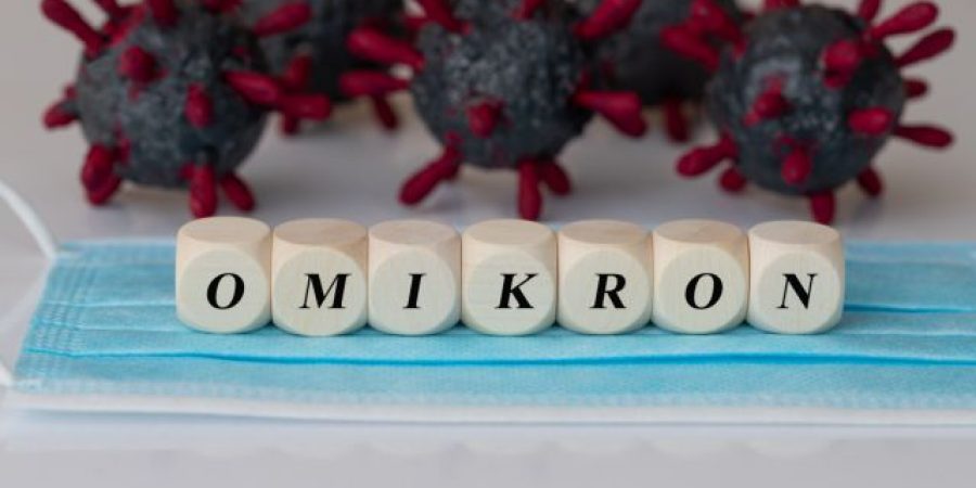 The,Word,Omikron,On,Wooden,Cubes,,With,Virus,Models,In